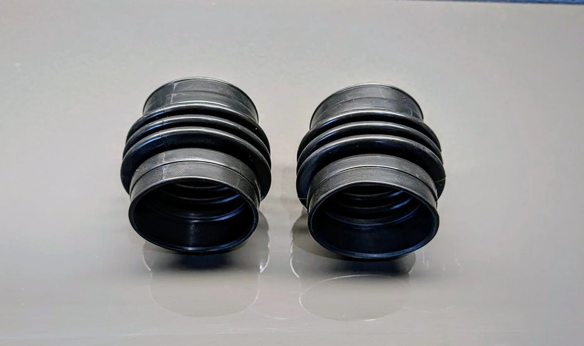 Left and right BMW E31 M70/S70 V12 upper rubber air intake boots, OEM 13711725816.