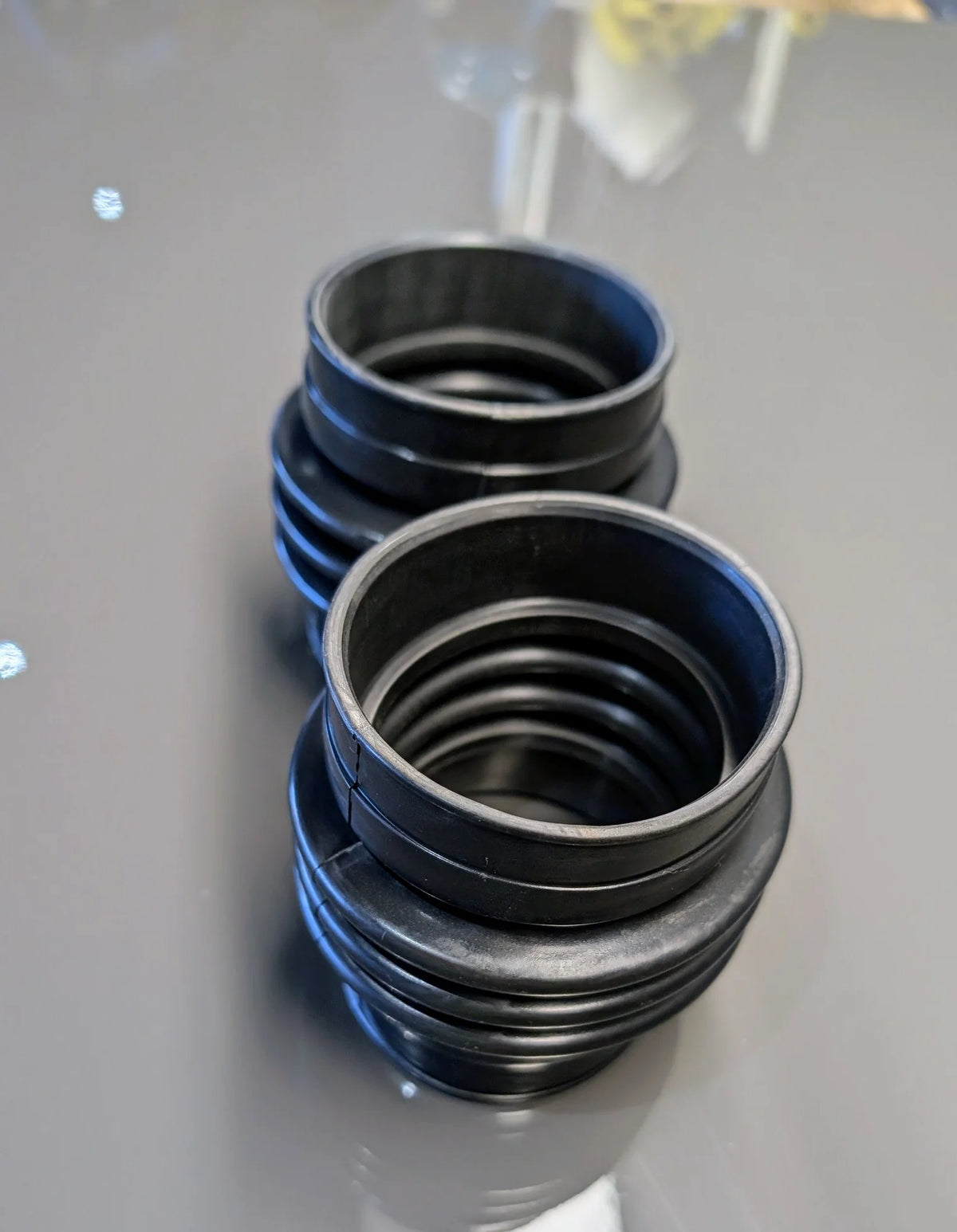 Left and right BMW E31 M70/S70 V12 upper rubber air intake boots, OEM 13711725816. 1